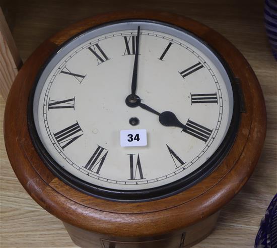 An oak cased wall clock